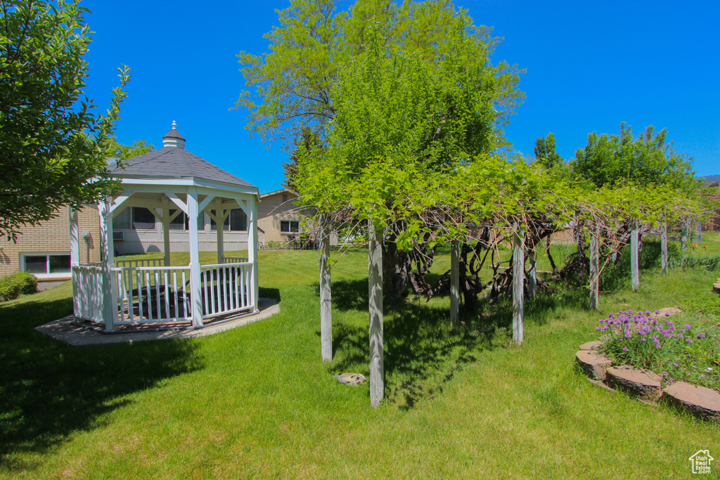 View of green lawn featuring a gazebo