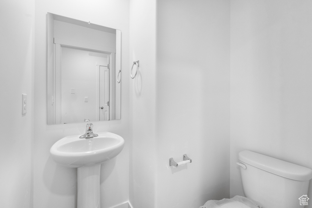 Half bath featuring toilet