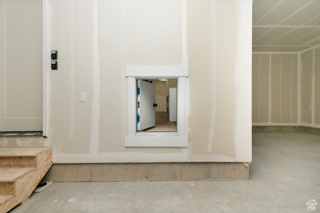 Interior space featuring concrete flooring
