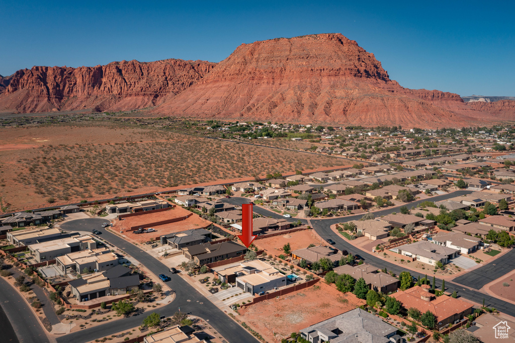 View of mountain backdrop featuring nearby suburban area