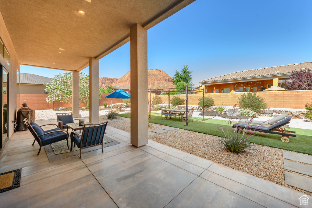 Fenced backyard with a patio and a mountain view