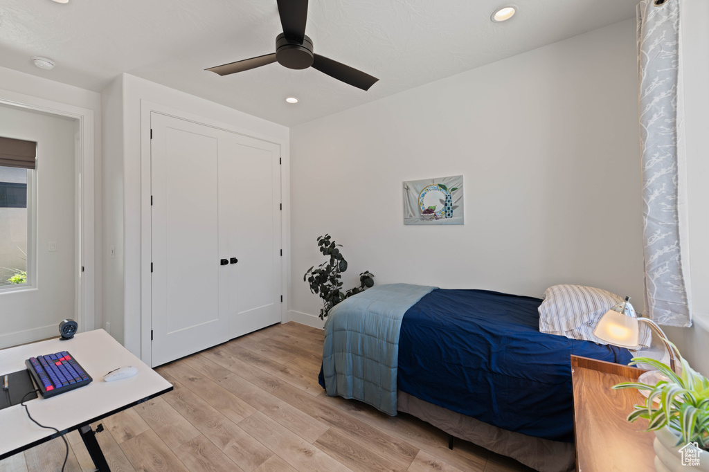 Bedroom featuring light wood-style flooring, recessed lighting, and a ceiling fan