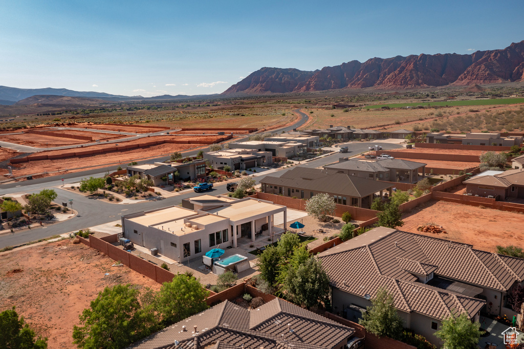 Aerial view of residential area featuring a mountain backdrop