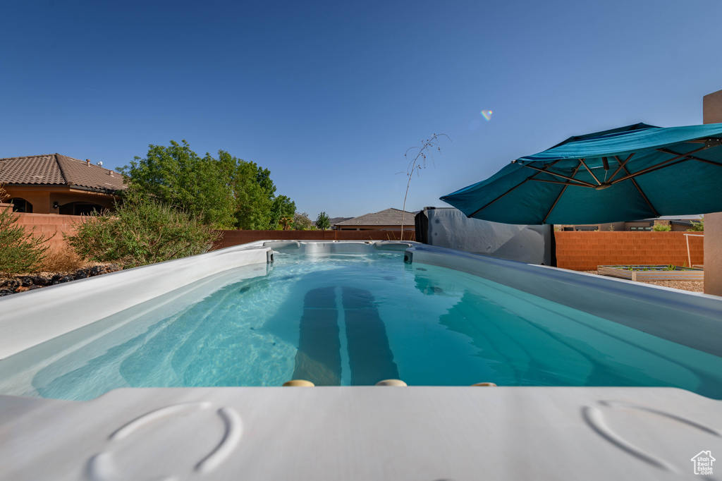 View of pool featuring a fenced backyard