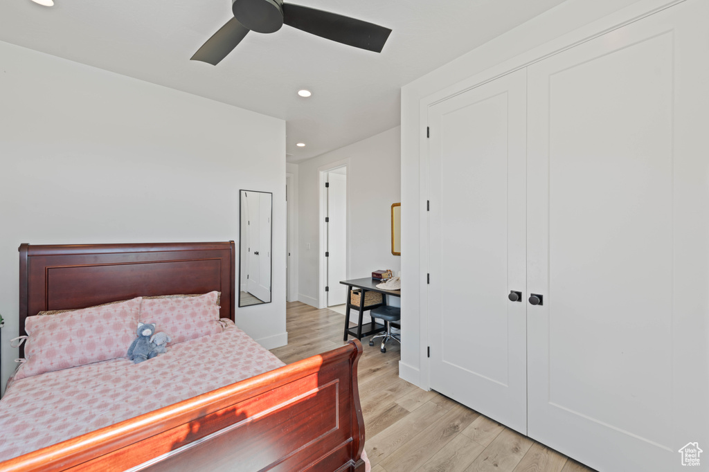 Bedroom featuring recessed lighting, light wood-type flooring, a closet, ceiling fan, and a desk