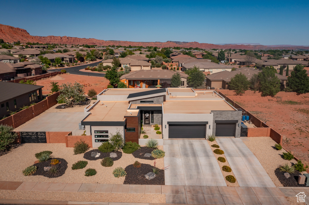 Aerial view of residential area with a mountain backdrop