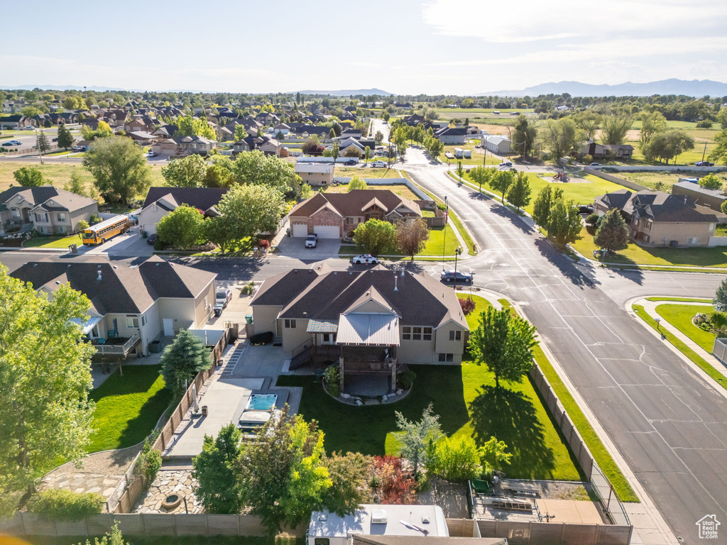 Aerial perspective of suburban area featuring a mountainous background