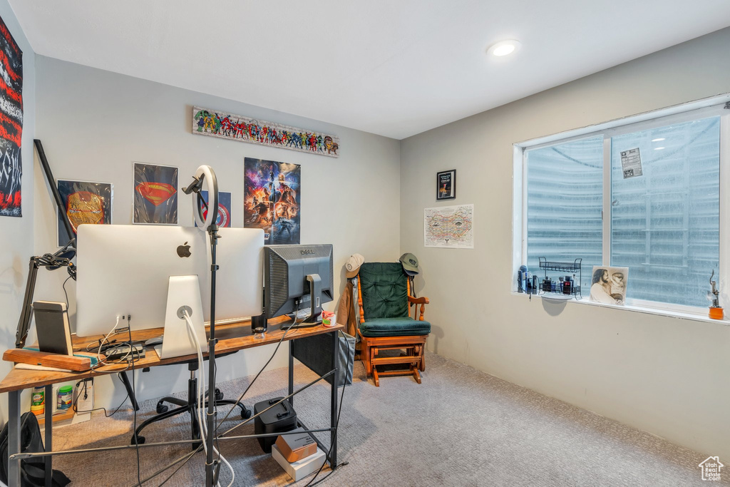 Home office with carpet floors and recessed lighting