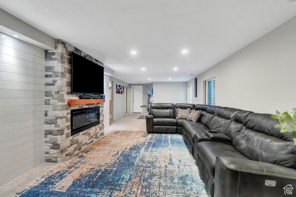 Living area featuring recessed lighting and a fireplace