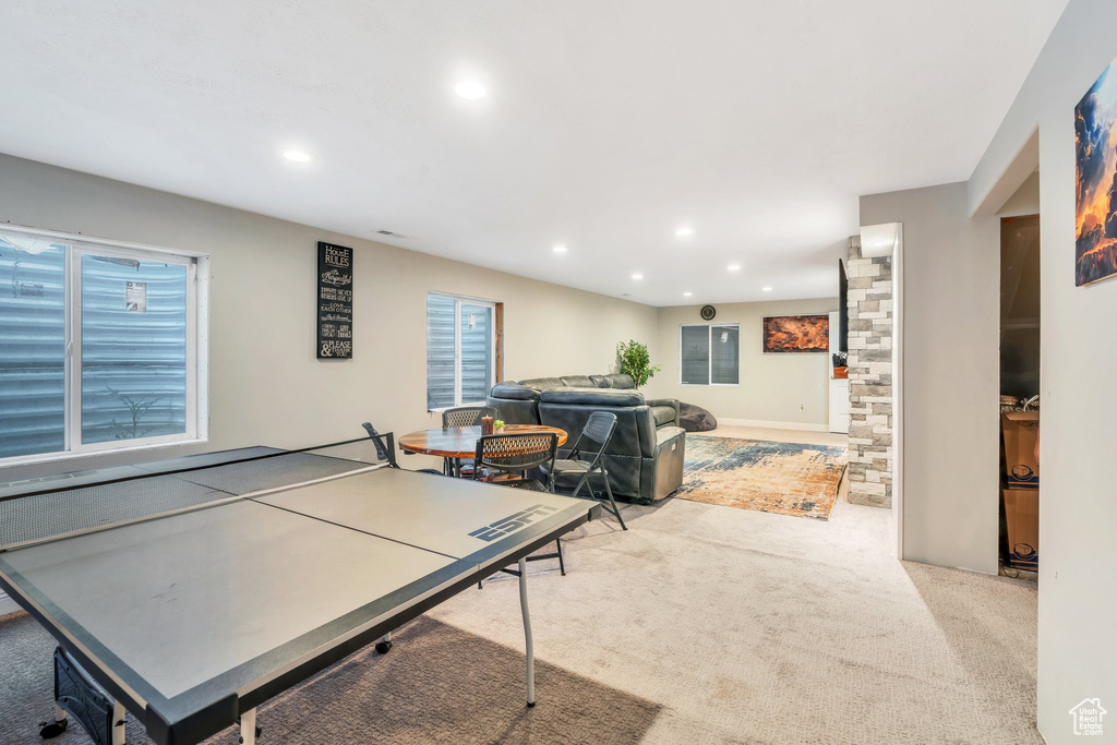 Rec room with recessed lighting and light carpet