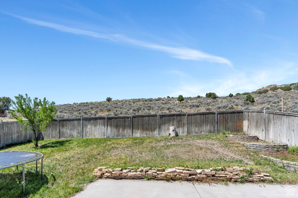 View of fenced backyard