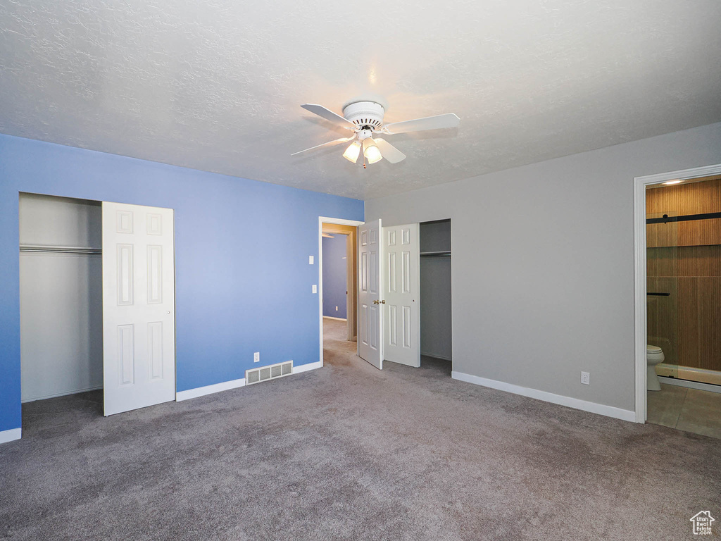 Unfurnished bedroom featuring baseboards, carpet, and a textured ceiling