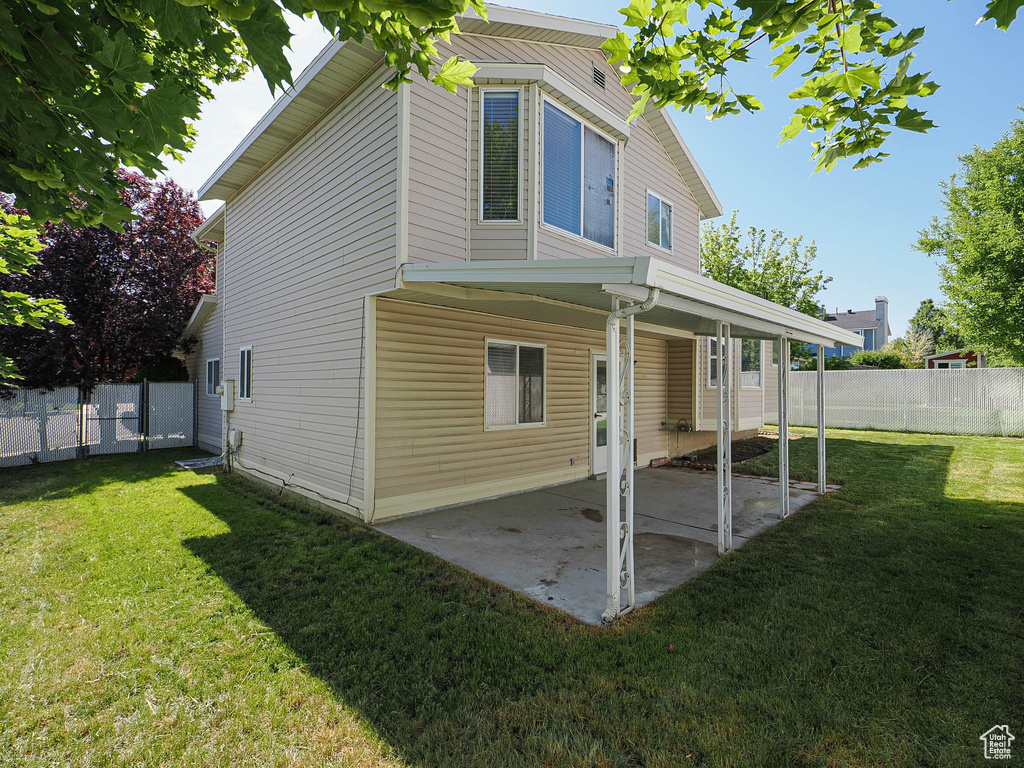 Rear view of house featuring a patio area