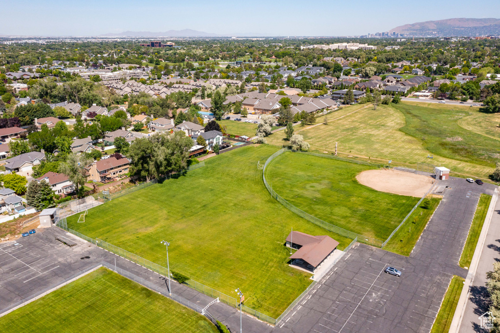 Aerial perspective of suburban area with a mountain backdrop