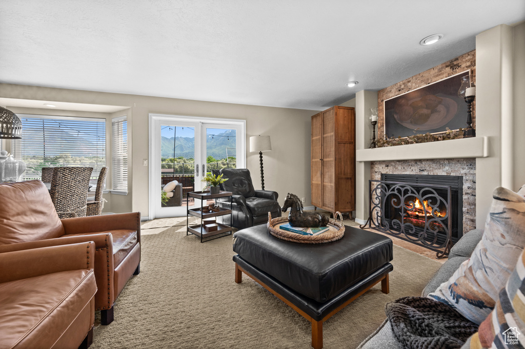 Living room with a large fireplace and carpet