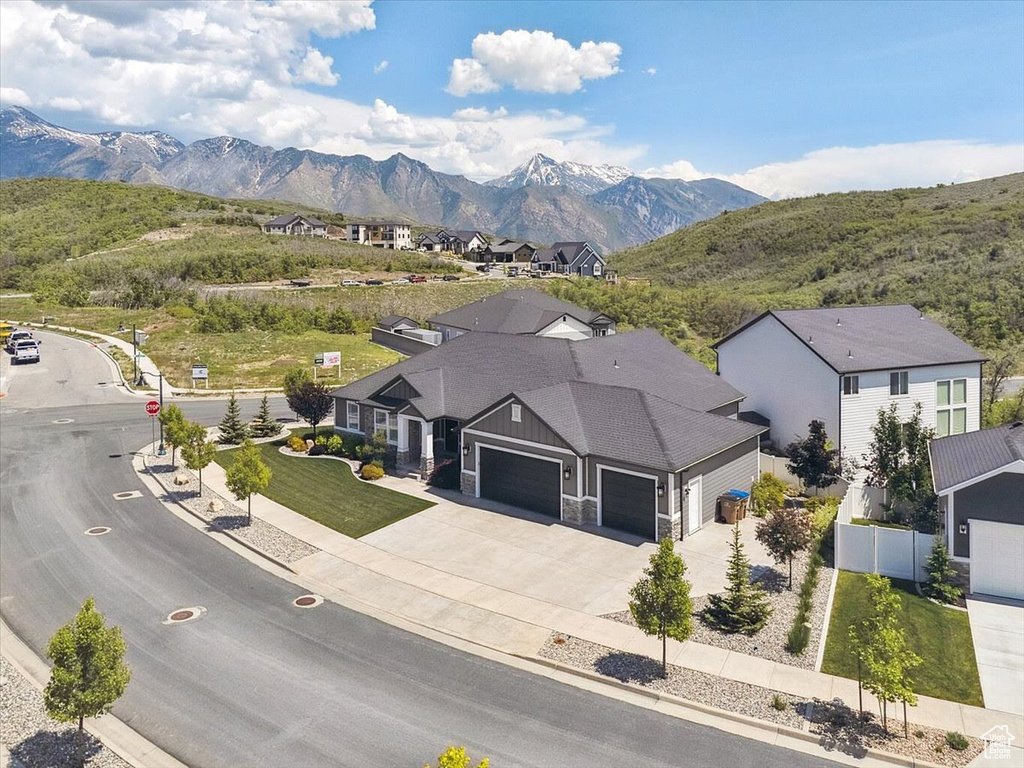 Aerial perspective of suburban area with a mountain backdrop