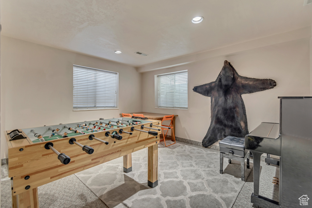 Recreation room with recessed lighting and baseboards