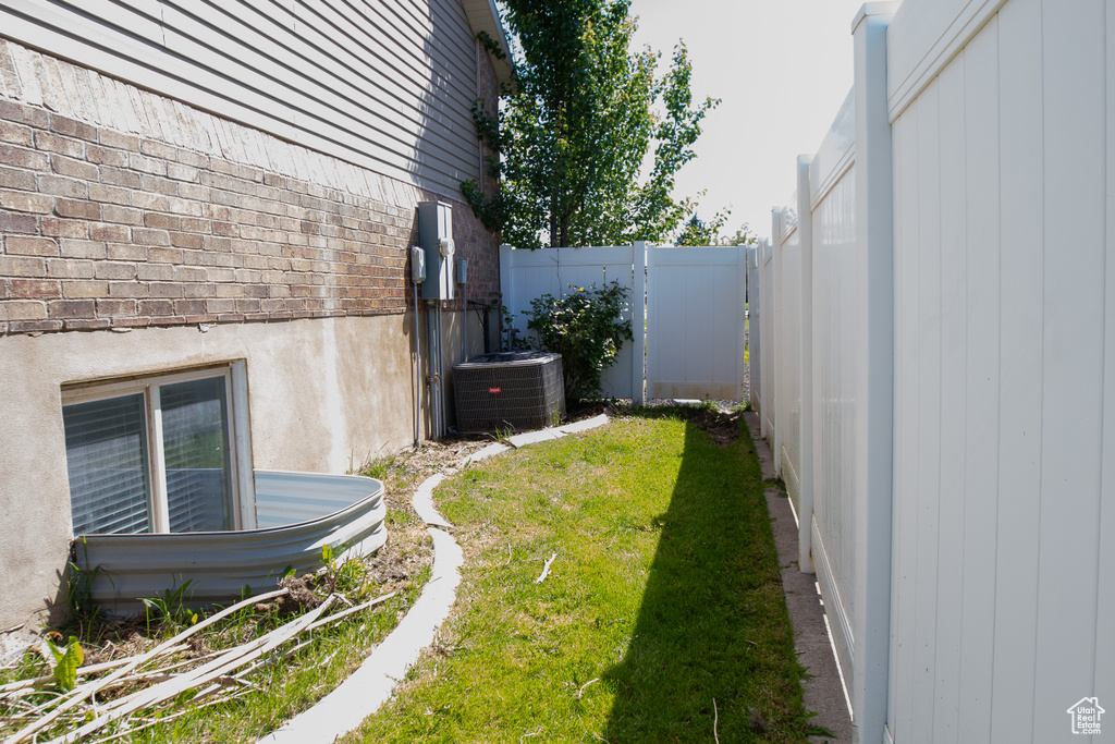 View of yard featuring central AC unit