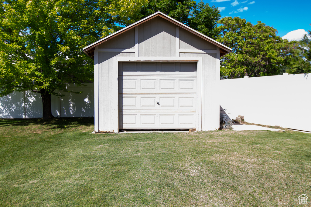 Garage featuring a shed