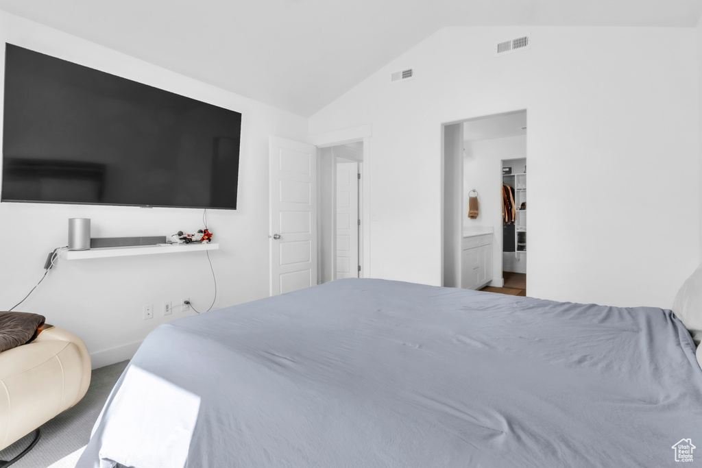 Bedroom featuring vaulted ceiling