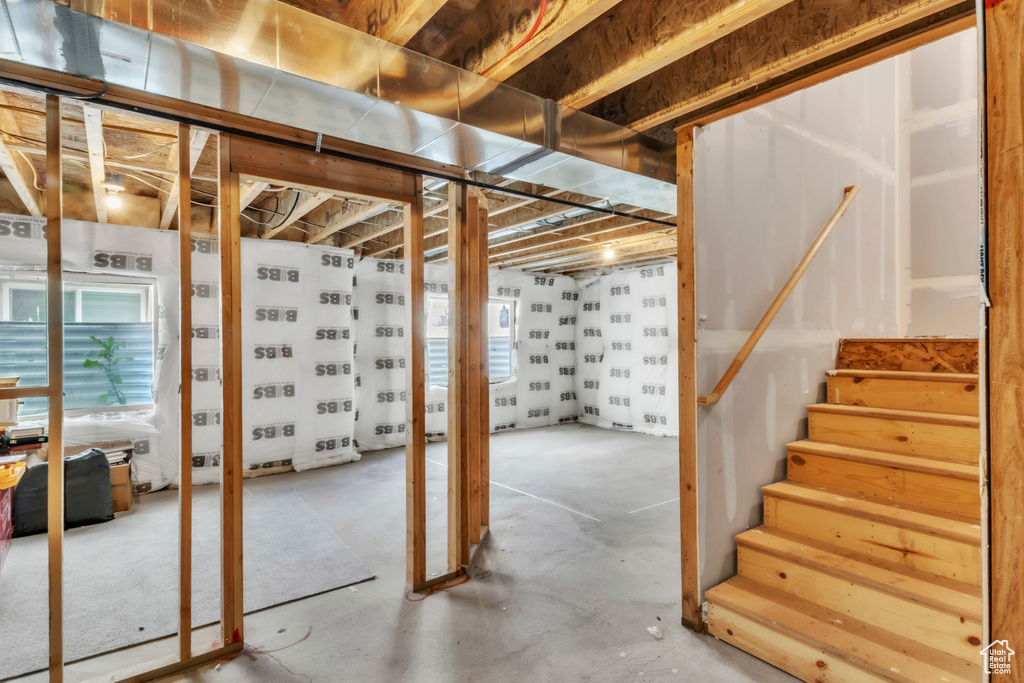 Below grade area featuring healthy amount of natural light and stairway