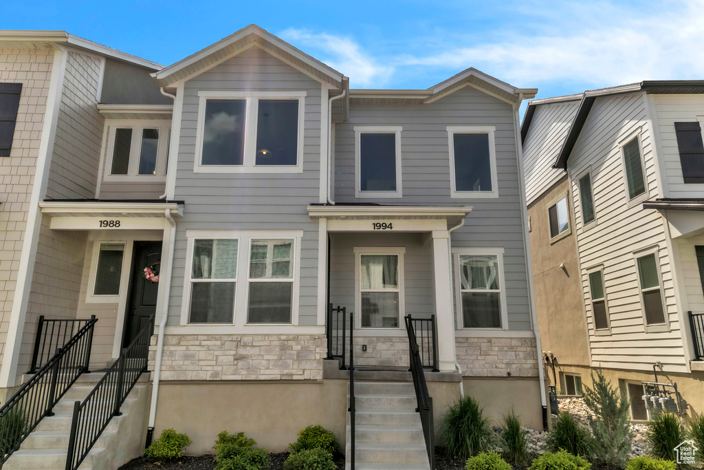Townhome / multi-family property with stone siding