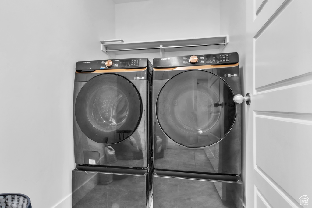 Laundry area with washer and clothes dryer