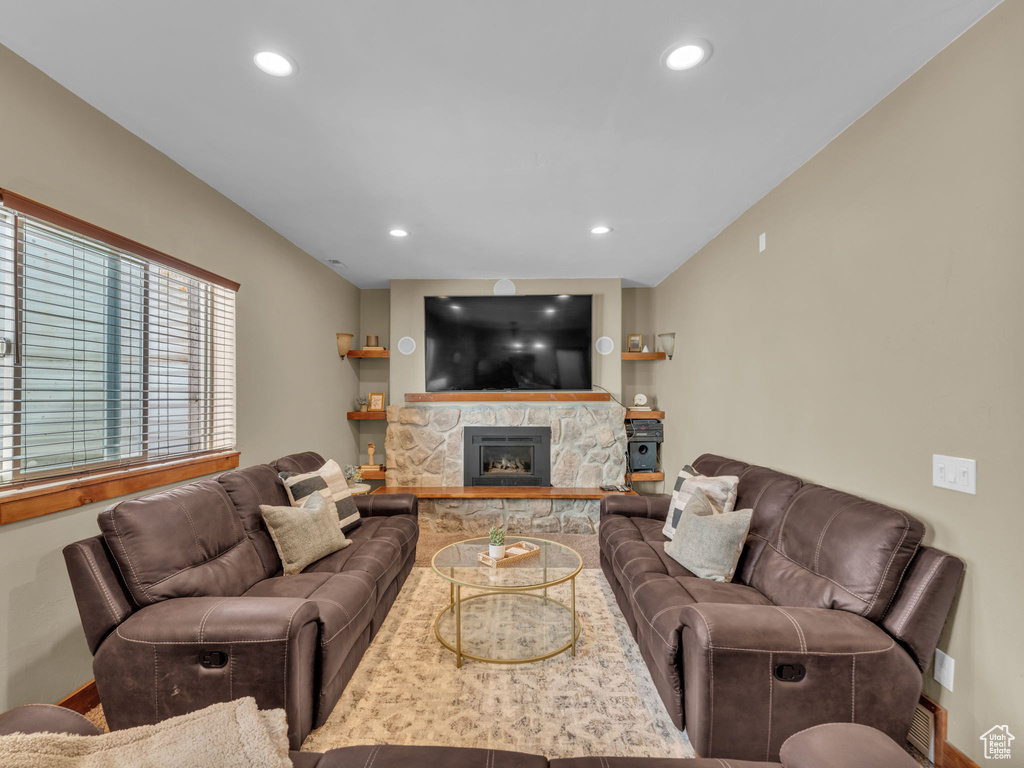 Living room featuring a fireplace and recessed lighting