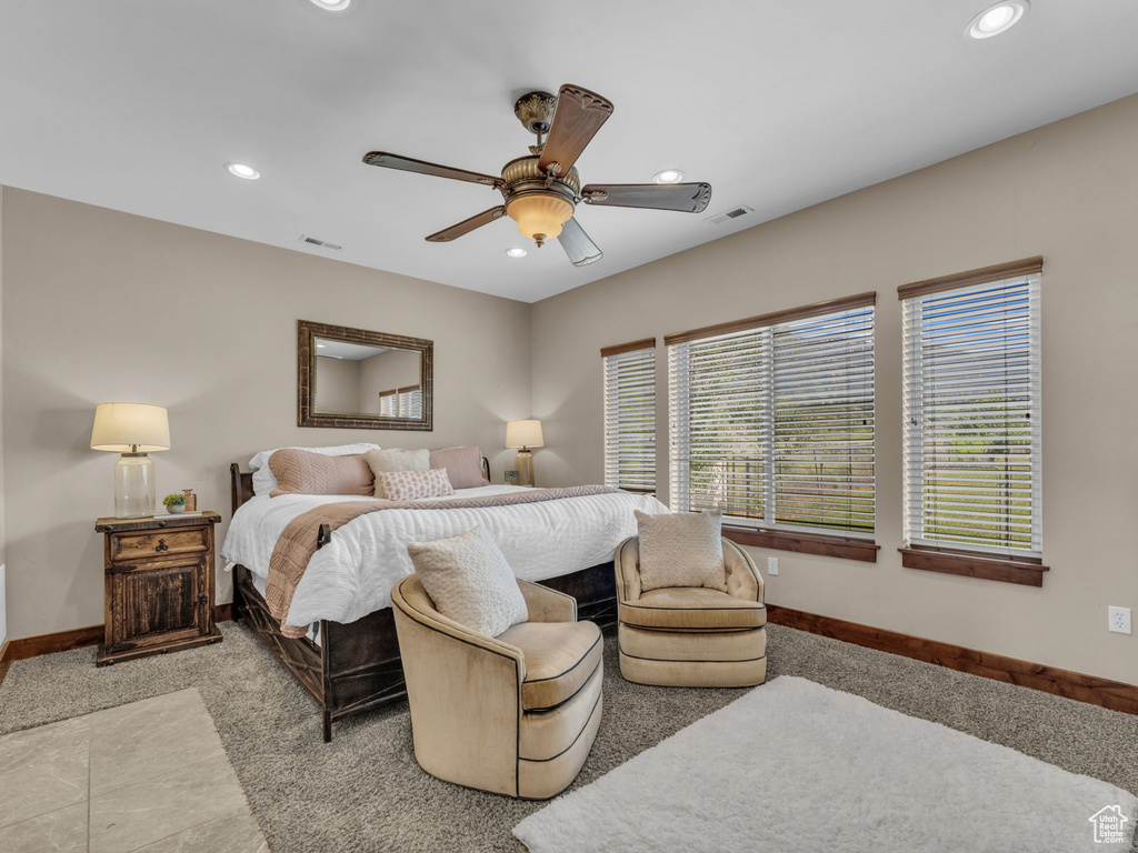 Bedroom with recessed lighting, baseboards, ceiling fan, and light carpet