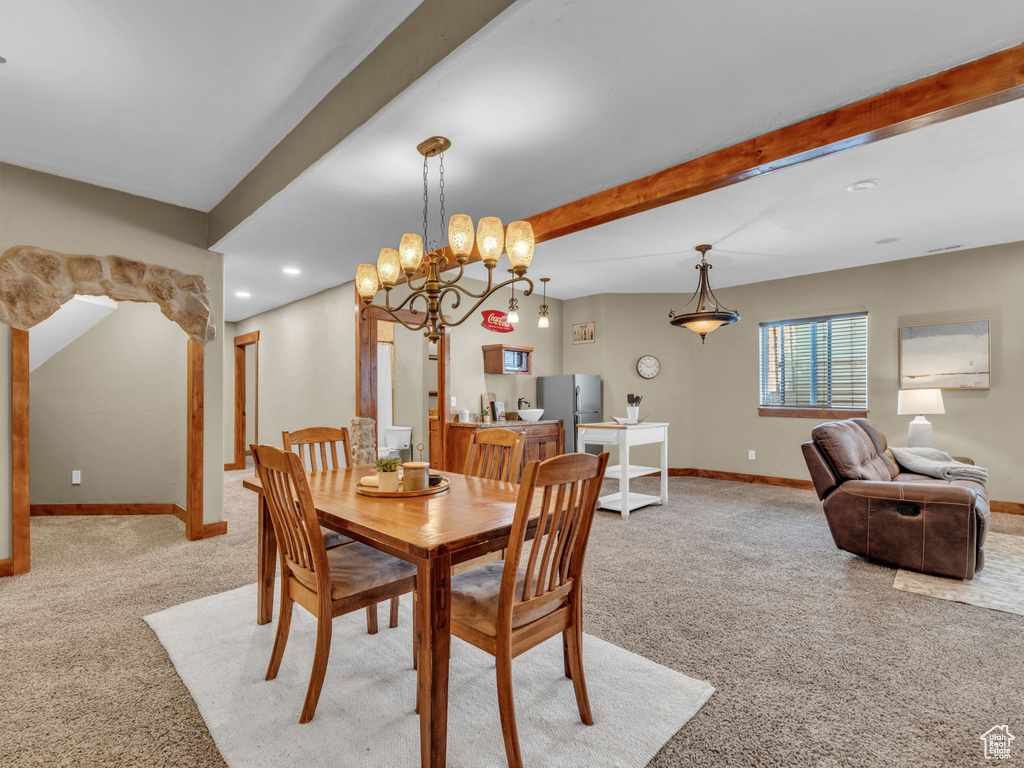 Dining area with light carpet, baseboards, beamed ceiling, recessed lighting, and a desk