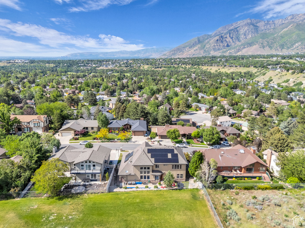 Aerial view of residential area featuring a mountain backdrop