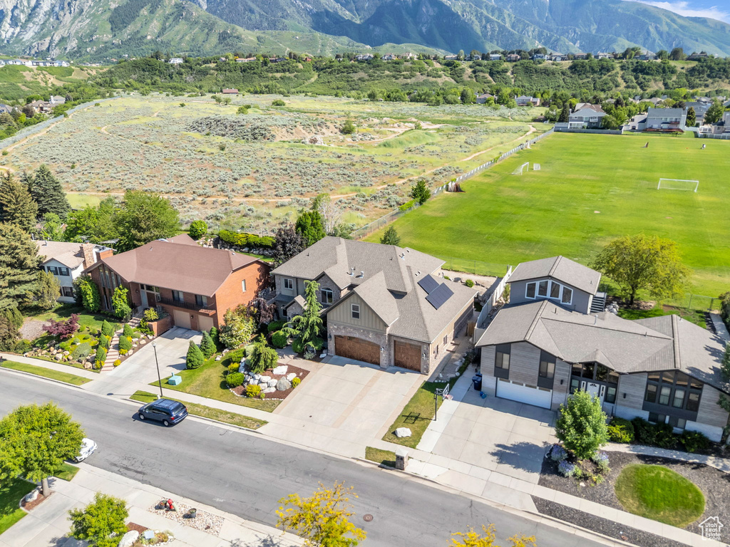 Aerial perspective of suburban area featuring a mountain backdrop