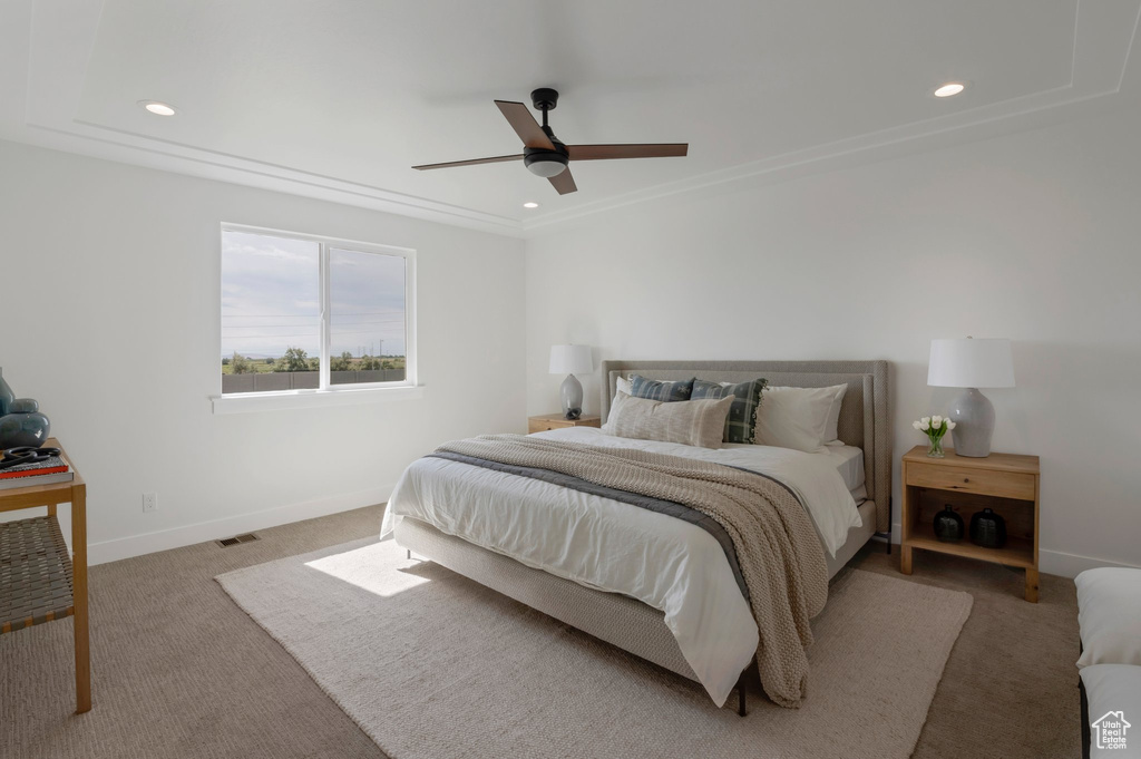 Carpeted bedroom featuring recessed lighting and a ceiling fan