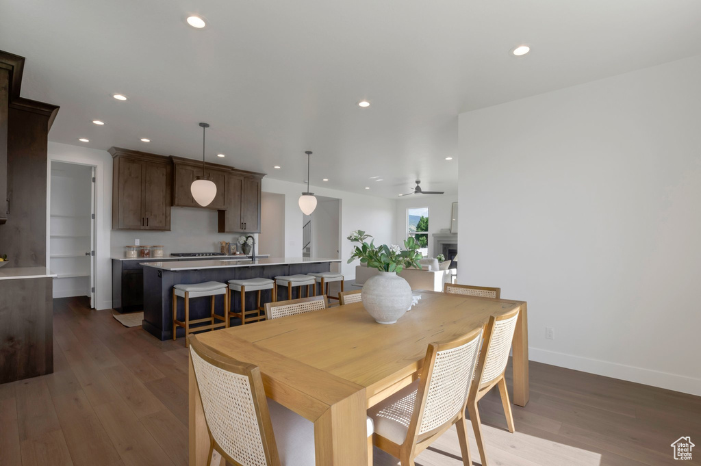 Dining area with recessed lighting, wood finished floors, and a ceiling fan