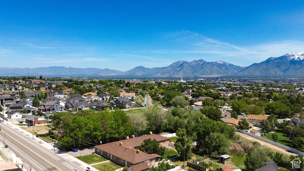 Aerial view of residential area featuring a mountain backdrop