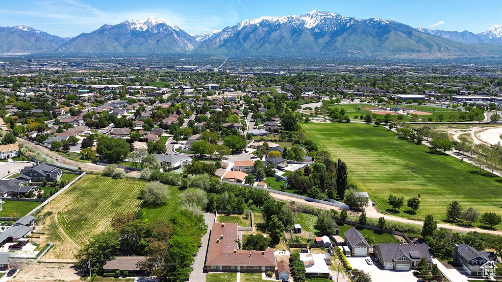 Aerial view of residential area featuring a mountainous background