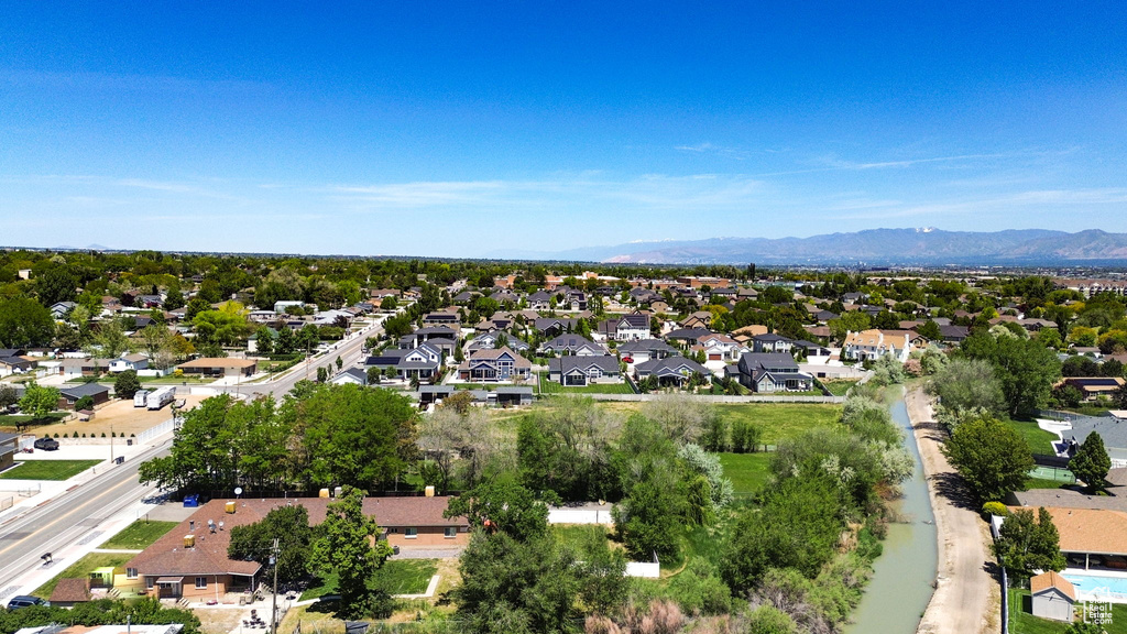 Aerial perspective of suburban area featuring a mountainous background