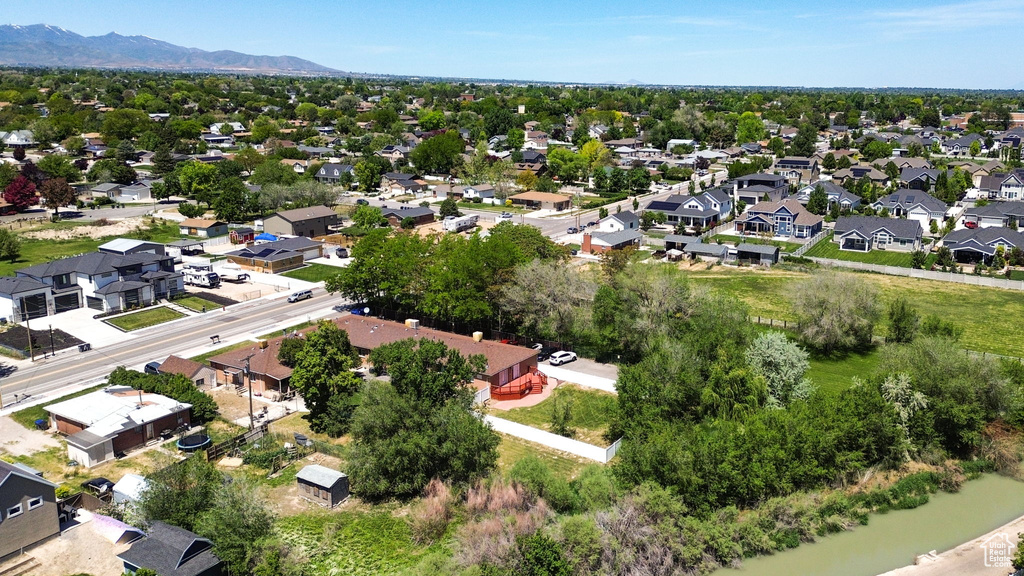 Aerial perspective of suburban area with a mountain backdrop