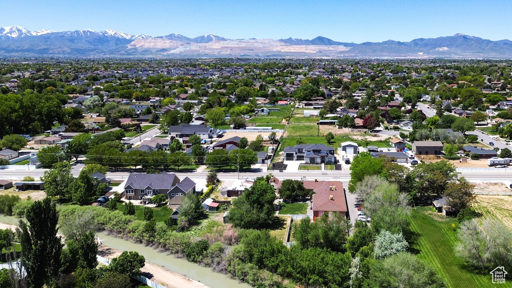 Aerial perspective of suburban area with a mountain backdrop