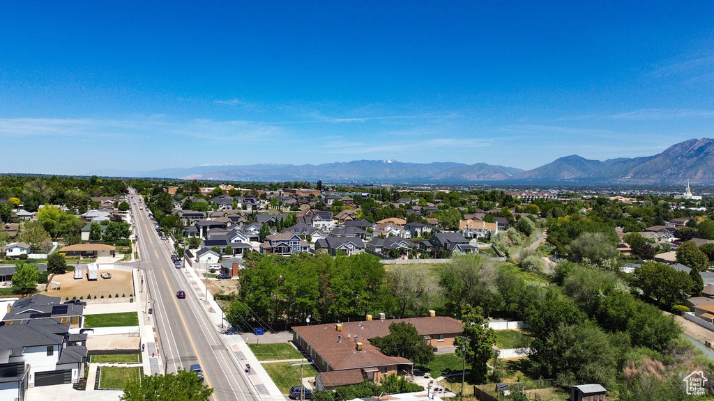 Aerial view of residential area featuring a mountainous background