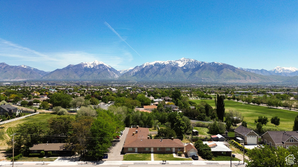 View of mountain backdrop featuring nearby suburban area