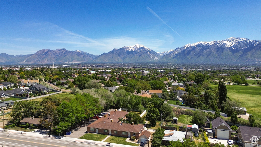 Aerial perspective of suburban area featuring a mountain backdrop