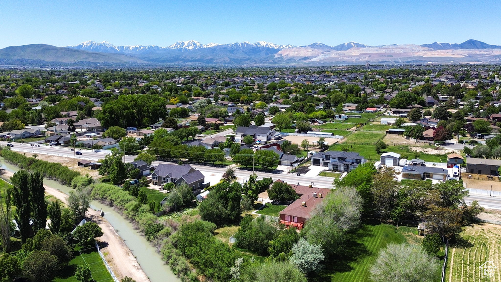 Aerial perspective of suburban area featuring a mountainous background