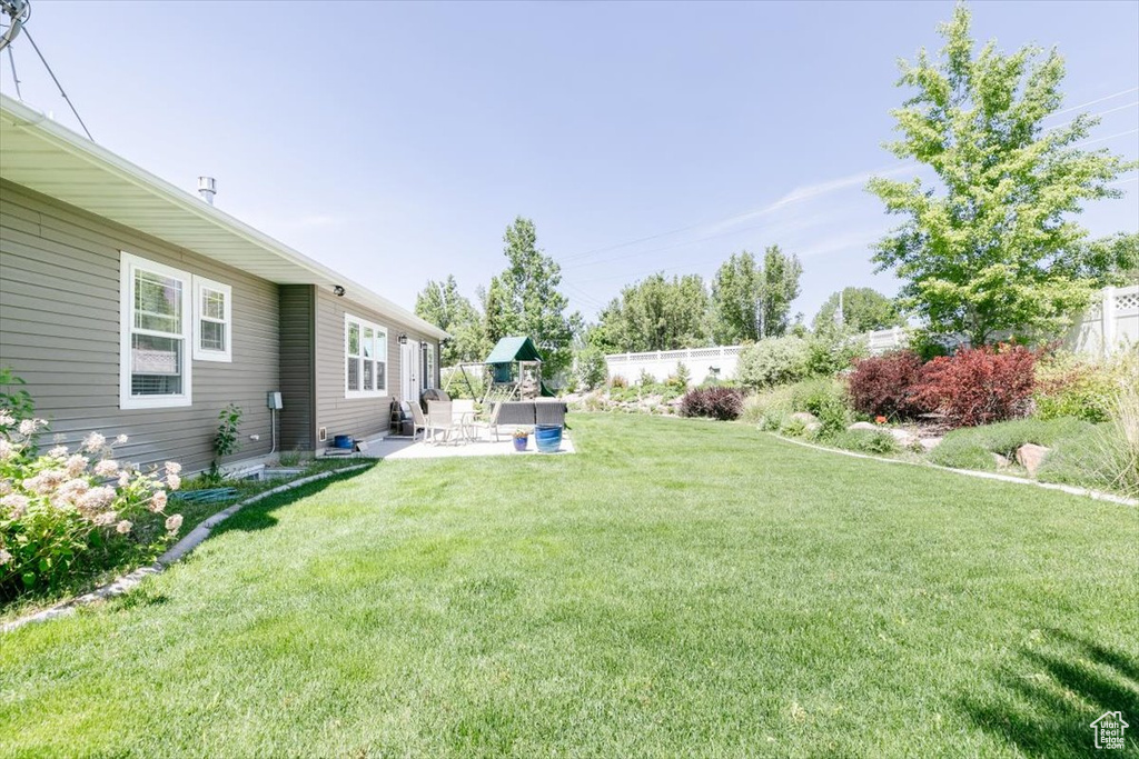 View of yard with a patio area