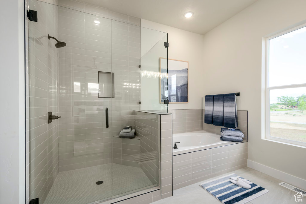 Full bath with a shower stall, a bath, tile patterned flooring, baseboards, and recessed lighting