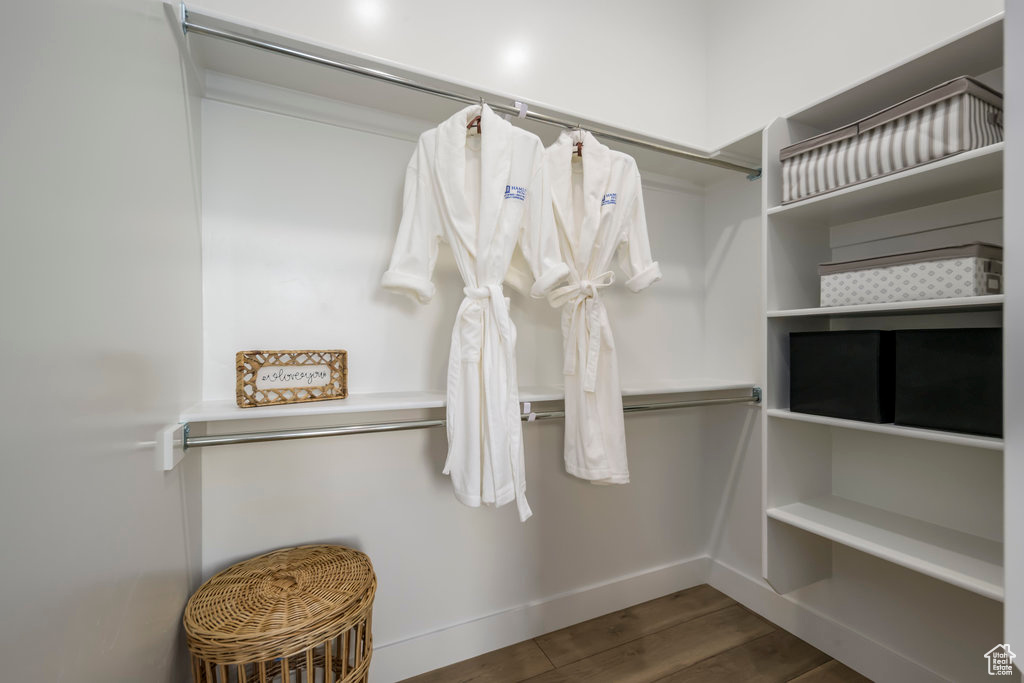 Walk in closet featuring wood finished floors