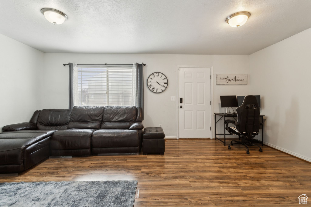 Living room featuring wood finished floors and baseboards