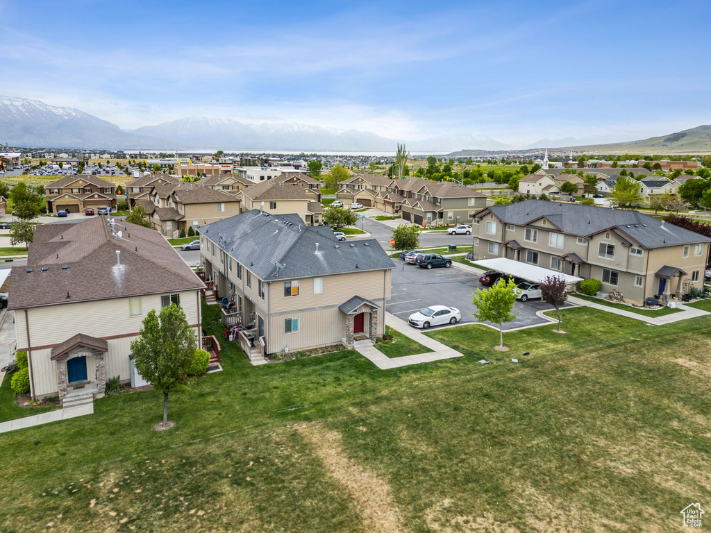 Aerial perspective of suburban area featuring a mountainous background