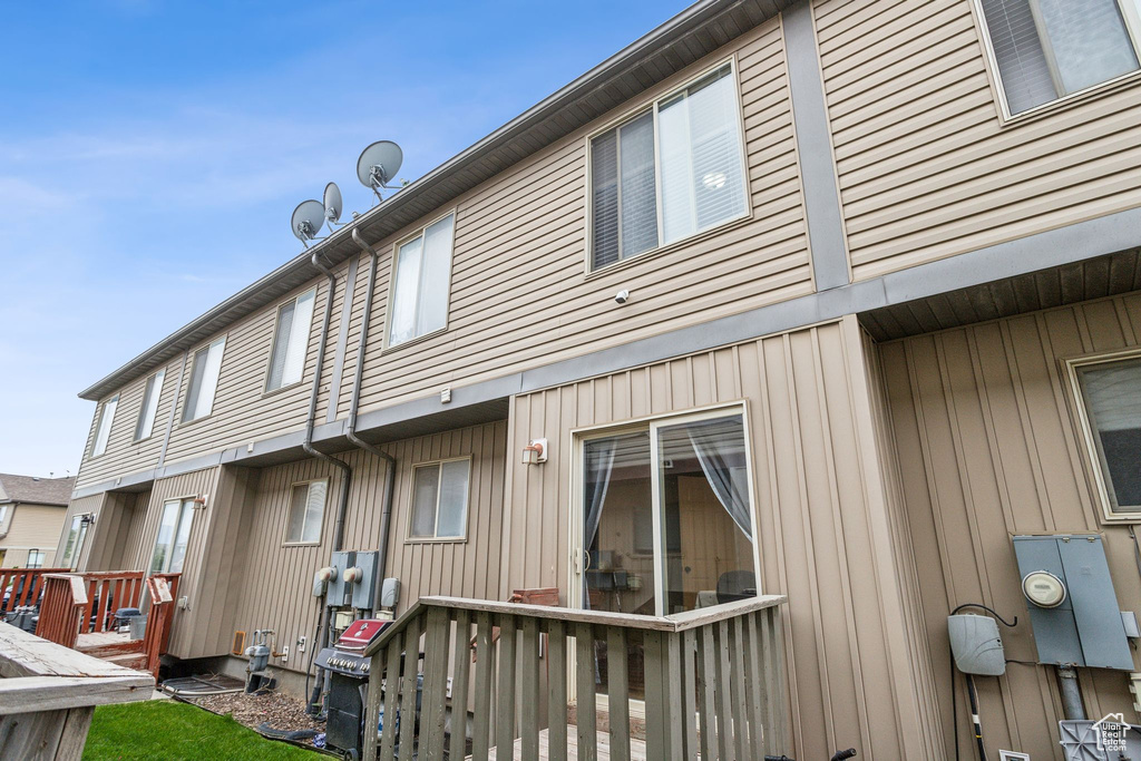 Back of property featuring board and batten siding