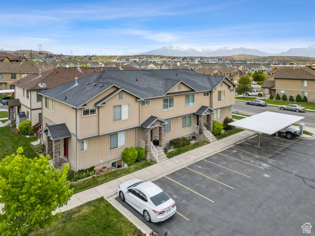 Aerial perspective of suburban area featuring a mountain backdrop